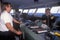 The captain of the ferry Bluenose speaking on the bridge phone while a crew member navigates the boat, Yarmouth, Nova Scotia