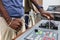 Captain`s hands at the helm of a boat