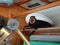 A captain`s hat on the side of the shelf in the cockpit of a submarine