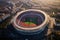 This captivating aerial photograph showcases a soccer stadium filled with enthusiastic fans and an intense match in progress,