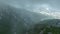 Captivating Drama: Aerial Perspective of the Enigmatic Winding Road and the Cloud-Enveloped Mystical Forest