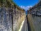 This captivating drone photo captures the breathtaking scenery at Pandawa Beach in Bali. The narrow road snakes its way