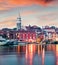 Captivating evening cityscape of old fishing town Isola. Fantastic spring seascape of Adriatic Sea. Beautiful outdoor scene of