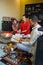 Captivating moment of Indian married couple participating in traditional Pooja and Hawan ceremony with a Pandit chanting mantras