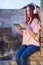 Captivating Redhead Woman Immersed in Music - Digital Delight on Sunset Ruins