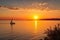 captivating sunrise over the sea, with sailboat and yacht in view