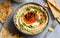 Capture the essence of Baba Ghanoush in a mouthwatering food photography shot