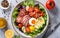 Capture the essence of Cobb Salad in a mouthwatering food photography shot