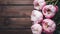 Capture Stunning pink peonies on rustic wooden background, copy space