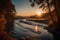 Capture the tranquil beauty of a winding river at sunset in a photograph, showcasing its realistic and detailed textures and