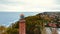 Captured by drone on a cloudy November day, the Gaski lighthouse stands against the somber sky. The tranquil sea with gentle