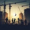 Capturing the Essence of Urban Labor Silhouettes of Construction Workers Amidst Cityscape