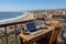 Capturing the serenity. engaging scene of a person typing on a laptop by the tranquil ocean shore