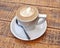Capuccino cup on wooden background