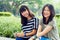 Capus life is awesome. Portrait of two female students sitting together on campus.