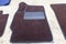 Car 3D handmade floor mats of brown color from wool for front and rear passengers of a vehicle in an interior design workshop with