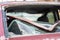 A car after an accident with a broken rear window. Broken window in a vehicle. The wreckage of the interior of a modern car after