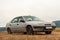 Car against mountains. Closeup photo of offroad wheel