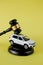 Car auction concept - gavel and car key on yellow background. Accident lawsuit or insurance, court case