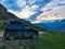 A car on the background of a mountain view from the ancient village of Goor. Russia, Dagestan 2021