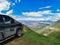 A car on the background of a view of the Matlas plateau. Khunzakhsky district. Dagestan Russia 2021