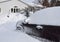 Car blocked by tall snow banks