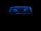 A car with blue neon light inside the passenger compartment, on a dark night