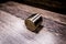 Car brake piston on wooden background