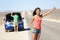 Car breakdown problems - woman hitchhiking