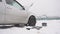 Car breakdown in winter, low-quality diesel fuel freezing and weak battery, problem start, slow motion, instrument