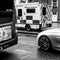 A Car Bus And Ambulance On A High Street, CLose Up With No People