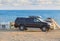 Car, camper, tent on the seashore on camping