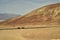 Car and camper in vast desert landscape Artist`s Drive road Death Valley