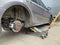 Car in a car service, repair of wheels. Concept: tire fitting, vulcanization, tire change. Car on a jack, changing wheels. Kiev