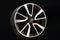 Car cast aluminum alloy wheels, black silver with polished front, very beautiful and modern, fashion. Close-up on dark background