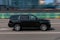 car Chevrolet Tahoe Third generation driving fast on the city streets with motion blur