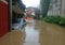 Car in the courtyard of the House submerged by flood mud