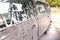 The car is covered with foam at a self-service car wash. Close-up of side windows