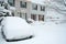 Car covered with snow in winter