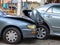 Car crash accident on street with wreck and damaged automobiles. Accident caused by negligence And lack of ability to drive. Due t