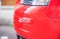 Car crash, close-up of red scratched bumper