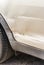 Car crash, close-up of scratched and damaged silver car door