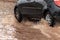 Car crossing flooded street after rains