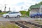 Car is crossing a railway crossing. Dangerous intersection with railroad rails.