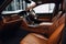 car with custom cabin, including seats in leather and wood trim accessories