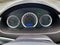 Car dashboard. Speedometer, circular tachometer, oil and fuel level, mileage. Outside the window it is raining, the