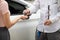 car dealer delivers keys to customer after customer has selected car they want and agreed to buy the car with the dealer. The