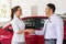 Car dealer handshake customer