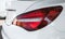 Car detailing : Glass coating Closeup modern glossy shine modern luxury white Back lights headlight and head lamp sport car .