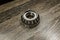 Car differential bearings on wooden background